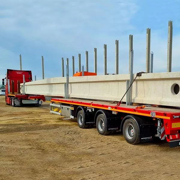 Hvordan reducerer standard bjælketransport sættevogne overdimensionerede lasttransportrisici og flådedriftsomkostninger?